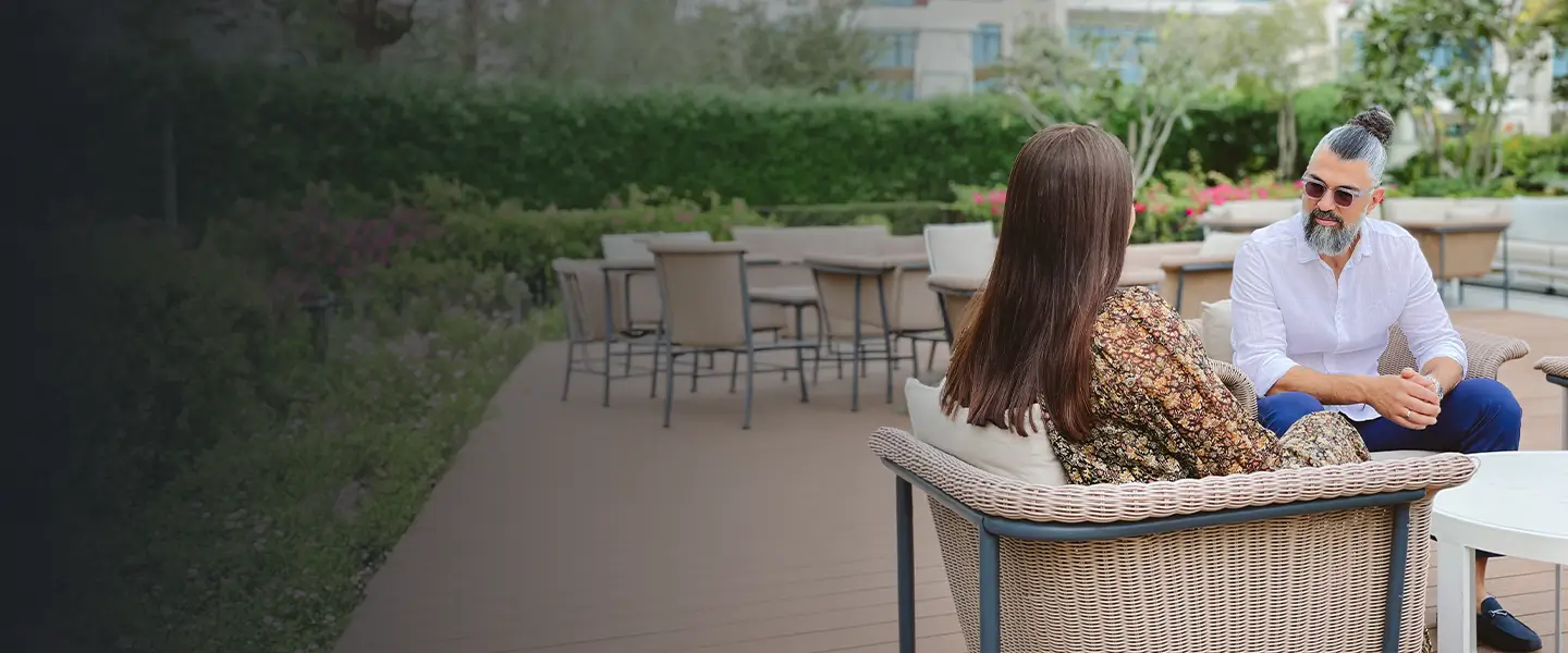 Executive coach in Dubai in a focused one-to-one session with a CEO reviewing strategic decisions and leadership blind spots